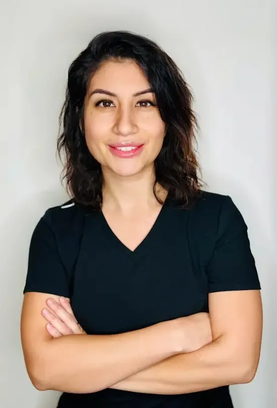a woman with her arms crossed
